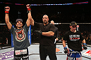 SEATTLE, WA - DECEMBER 08:  Ramsey Nijem (left) reacts to being declared the winner over Joe Proctor (right) after their lightweight bout at the UFC on FOX event on December 8, 2012  at Key Arena in Seattle, Washington.  (Photo by Ezra Shaw/Zuffa LLC/Zuffa LLC via Getty Images) *** Local Caption *** Ramsey Nijem; Joe Proctor