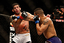 SEATTLE, WA - DECEMBER 08:  (R-L) Mike Easton punches Raphael Assuncao during their bantamweight bout at the UFC on FOX event on December 8, 2012  at Key Arena in Seattle, Washington.  (Photo by Ezra Shaw/Zuffa LLC/Zuffa LLC via Getty Images) *** Local Caption *** Raphael Assuncao; Mike Easton