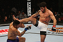 SEATTLE, WA - DECEMBER 08:  (R-L) Raphael Assuncao kicks Mike Easton during their bantamweight bout at the UFC on FOX event on December 8, 2012  at Key Arena in Seattle, Washington.  (Photo by Ezra Shaw/Zuffa LLC/Zuffa LLC via Getty Images) *** Local Caption *** Raphael Assuncao; Mike Easton