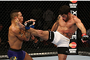 SEATTLE, WA - DECEMBER 08:  (R-L) Raphael Assuncao kicks Mike Easton during their bantamweight bout at the UFC on FOX event on December 8, 2012  at Key Arena in Seattle, Washington.  (Photo by Ezra Shaw/Zuffa LLC/Zuffa LLC via Getty Images) *** Local Caption *** Raphael Assuncao; Mike Easton