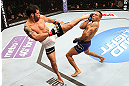 SEATTLE, WA - DECEMBER 08:  (L-R) Raphael Assuncao kicks Mike Easton during their bantamweight bout at the UFC on FOX event on December 8, 2012  at Key Arena in Seattle, Washington.  (Photo by Ezra Shaw/Zuffa LLC/Zuffa LLC via Getty Images) *** Local Caption *** Raphael Assuncao; Mike Easton