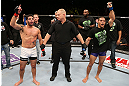 SEATTLE, WA - DECEMBER 08:  Raphael Assuncao (left) and Raphael Assuncao await the official decision after their bantamweight bout at the UFC on FOX event on December 8, 2012  at Key Arena in Seattle, Washington.  (Photo by Ezra Shaw/Zuffa LLC/Zuffa LLC via Getty Images) *** Local Caption *** Raphael Assuncao; Mike Easton