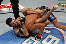 SEATTLE, WA - DECEMBER 08:  Matt Brown (R) atttempts to submit Mike Swick during their welterweight bout at the UFC on FOX event on December 8, 2012  at Key Arena in Seattle, Washington.  (Photo by Ezra Shaw/Zuffa LLC/Zuffa LLC via Getty Images) *** Local Caption *** Mike Swick; Matt Brown