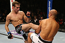 SEATTLE, WA - DECEMBER 08:  (L-R) Rory MacDonald kicks BJ Penn during their welterweight bout at the UFC on FOX event on December 8, 2012  at Key Arena in Seattle, Washington.  (Photo by Ezra Shaw/Zuffa LLC/Zuffa LLC via Getty Images) *** Local Caption *** BJ Penn; Rory MacDonald
