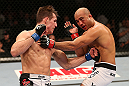 SEATTLE, WA - DECEMBER 08:  (L-R) Rory MacDonald punches BJ Penn during their welterweight bout at the UFC on FOX event on December 8, 2012  at Key Arena in Seattle, Washington.  (Photo by Ezra Shaw/Zuffa LLC/Zuffa LLC via Getty Images) *** Local Caption *** BJ Penn; Rory MacDonald