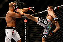 SEATTLE, WA - DECEMBER 08:  (R-L) Rory MacDonald kicks BJ Penn during their welterweight bout at the UFC on FOX event on December 8, 2012  at Key Arena in Seattle, Washington.  (Photo by Josh Hedges/Zuffa LLC/Zuffa LLC via Getty Images) *** Local Caption *** BJ Penn; Rory MacDonald