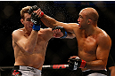 SEATTLE, WA - DECEMBER 08:  (R-L) BJ Penn punches Rory MacDonald during their welterweight bout at the UFC on FOX event on December 8, 2012  at Key Arena in Seattle, Washington.  (Photo by Josh Hedges/Zuffa LLC/Zuffa LLC via Getty Images) *** Local Caption *** BJ Penn; Rory MacDonald