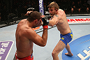 SEATTLE, WA - DECEMBER 08:  (R-L) Alexander Gustafsson punches Mauricio Rua during their light heavyweight bout at the UFC on FOX event on December 8, 2012  at Key Arena in Seattle, Washington.  (Photo by Ezra Shaw/Zuffa LLC/Zuffa LLC via Getty Images) *** Local Caption *** Mauricio Rua; Alexander Gustafsson