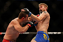 SEATTLE, WA - DECEMBER 08:  Mauricio Rua (left) punches Alexander Gustafsson (right) during their light heavyweight bout at the UFC on FOX event on December 8, 2012  at Key Arena in Seattle, Washington.  (Photo by Josh Hedges/Zuffa LLC/Zuffa LLC via Getty Images) *** Local Caption *** Mauricio Rua; Alexander Gustafsson