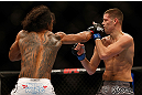 SEATTLE, WA - DECEMBER 08:  Benson Henderson (L) punches Nate Diaz (R) during their lightweight championship bout at the UFC on FOX event on December 8, 2012  at Key Arena in Seattle, Washington.  (Photo by Josh Hedges/Zuffa LLC/Zuffa LLC via Getty Images) *** Local Caption *** Benson Henderson; Nate Diaz