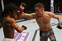 SEATTLE, WA - DECEMBER 08:  (R-L) Nate Diaz punches Benson Henderson during their lightweight championship bout at the UFC on FOX event on December 8, 2012  at Key Arena in Seattle, Washington.  (Photo by Ezra Shaw/Zuffa LLC/Zuffa LLC via Getty Images) *** Local Caption *** Benson Henderson; Nate Diaz