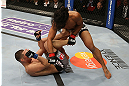 SEATTLE, WA - DECEMBER 08:  (R-L) Benson Henderson punches Nate Diaz during their lightweight championship bout at the UFC on FOX event on December 8, 2012  at Key Arena in Seattle, Washington.  (Photo by Ezra Shaw/Zuffa LLC/Zuffa LLC via Getty Images) *** Local Caption *** Benson Henderson; Nate Diaz
