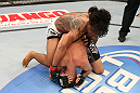 SEATTLE, WA - DECEMBER 08:  Benson Henderson (top) punches Nate Diaz during their lightweight championship bout at the UFC on FOX event on December 8, 2012  at Key Arena in Seattle, Washington.  (Photo by Ezra Shaw/Zuffa LLC/Zuffa LLC via Getty Images) *** Local Caption *** Benson Henderson; Nate Diaz