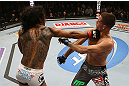 SEATTLE, WA - DECEMBER 08:  (L-R) Benson Henderson punches Nate Diaz during their lightweight championship bout at the UFC on FOX event on December 8, 2012  at Key Arena in Seattle, Washington.  (Photo by Ezra Shaw/Zuffa LLC/Zuffa LLC via Getty Images) *** Local Caption *** Benson Henderson; Nate Diaz