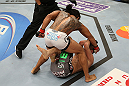 SEATTLE, WA - DECEMBER 08:  (top-bottom) Benson Henderson punches Nate Diaz during their lightweight championship bout at the UFC on FOX event on December 8, 2012  at Key Arena in Seattle, Washington.  (Photo by Ezra Shaw/Zuffa LLC/Zuffa LLC via Getty Images) *** Local Caption *** Benson Henderson; Nate Diaz