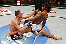 SEATTLE, WA - DECEMBER 08:  Nate Diaz (left) punches Benson Henderson (right) during their lightweight championship bout at the UFC on FOX event on December 8, 2012  at Key Arena in Seattle, Washington.  (Photo by Ezra Shaw/Zuffa LLC/Zuffa LLC via Getty Images) *** Local Caption *** Benson Henderson; Nate Diaz