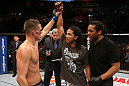 SEATTLE, WA - DECEMBER 08:  Nate Diaz (left) raises Benson Henderson's hand after their lightweight championship bout at the UFC on FOX event on December 8, 2012  at Key Arena in Seattle, Washington.  (Photo by Ezra Shaw/Zuffa LLC/Zuffa LLC via Getty Images) *** Local Caption *** Benson Henderson; Nate Diaz