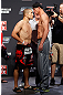 GOLD COAST, AUSTRALIA - DECEMBER 14:  (L-R) Opponents Mike Pierce and Seth Baczynski face off during the UFC on FX weigh in on December 14, 2012 at Gold Coast Convention and Exhibition Centre in Gold Coast, Queensland, Australia.  (Photo by Josh Hedges/Zuffa LLC/Zuffa LLC via Getty Images)