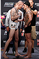 GOLD COAST, AUSTRALIA - DECEMBER 14:  (L-R) Opponents Colin Fletcher and Norman Parke face off during the UFC on FX weigh in on December 14, 2012 at Gold Coast Convention and Exhibition Centre in Gold Coast, Queensland, Australia.  (Photo by Josh Hedges/Zuffa LLC/Zuffa LLC via Getty Images)