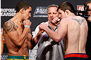 GOLD COAST, AUSTRALIA - DECEMBER 14:  (L-R) Opponents Robert Whittaker and Bradley Scott face off during the UFC on FX weigh in on December 14, 2012 at Gold Coast Convention and Exhibition Centre in Gold Coast, Queensland, Australia.  (Photo by Josh Hedges/Zuffa LLC/Zuffa LLC via Getty Images)