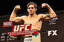 LAS VEGAS, NV - DECEMBER 14:  John Cofer steps onto the scale during TUF 16 Finale weigh in on December 14, 2012  at the Joint at the Hard Rock in Las Vegas, Nevada.  (Photo by Jim Kemper/Zuffa LLC/Zuffa LLC via Getty Images)