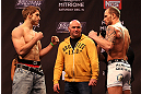 LAS VEGAS, NV - DECEMBER 14:  (L-R) TJ Waldburger and Nick Catone face off as UFC President Dana White looks on during TUF 16 Finale weigh in on December 14, 2012  at the Joint at the Hard Rock in Las Vegas, Nevada.  (Photo by Jim Kemper/Zuffa LLC/Zuffa LLC via Getty Images)