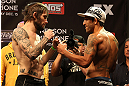 LAS VEGAS, NV - DECEMBER 14:  (L-R) Johnny Bedford and Marcos Vinicius face off during TUF 16 Finale weigh in on December 14, 2012  at the Joint at the Hard Rock in Las Vegas, Nevada.  (Photo by Jim Kemper/Zuffa LLC/Zuffa LLC via Getty Images)