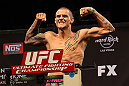 LAS VEGAS, NV - DECEMBER 14:  Dustin Poirier poses on the scale during TUF 16 Finale weigh in on December 14, 2012  at the Joint at the Hard Rock in Las Vegas, Nevada.  (Photo by Jim Kemper/Zuffa LLC/Zuffa LLC via Getty Images)