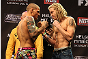 LAS VEGAS, NV - DECEMBER 14:  (L-R) Dustin Poirier and Jonathan Brookins face off during TUF 16 Finale weigh in on December 14, 2012  at the Joint at the Hard Rock in Las Vegas, Nevada.  (Photo by Jim Kemper/Zuffa LLC/Zuffa LLC via Getty Images)