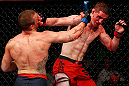 GOLD COAST, AUSTRALIA - DECEMBER 15:  (L-R) Mike Wilkinson punches Brendan Loughnane during their lightweight fight at the UFC on FX event on December 15, 2012  at Gold Coast Convention and Exhibition Centre in Gold Coast, Australia.  (Photo by Josh Hedges/Zuffa LLC/Zuffa LLC via Getty Images)