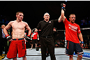 GOLD COAST, AUSTRALIA - DECEMBER 15:  Mike Wilkinson (R) reacts after defeating Brendan Loughnane during their lightweight fight at the UFC on FX event on December 15, 2012  at Gold Coast Convention and Exhibition Centre in Gold Coast, Australia.  (Photo by Josh Hedges/Zuffa LLC/Zuffa LLC via Getty Images)