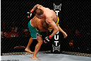 GOLD COAST, AUSTRALIA - DECEMBER 15:  (L-R) Manuel Rodriguez takes down Benny Alloway during their welterweight fight at the UFC on FX event on December 15, 2012  at Gold Coast Convention and Exhibition Centre in Gold Coast, Australia.  (Photo by Josh Hedges/Zuffa LLC/Zuffa LLC via Getty Images)