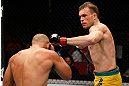 GOLD COAST, AUSTRALIA - DECEMBER 15:  (R-L) Benny Alloway punches Manuel Rodriguez during their welterweight fight at the UFC on FX event on December 15, 2012  at Gold Coast Convention and Exhibition Centre in Gold Coast, Australia.  (Photo by Josh Hedges/Zuffa LLC/Zuffa LLC via Getty Images)