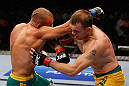 GOLD COAST, AUSTRALIA - DECEMBER 15:  (L-R) Manuel Rodriguez punches Benny Alloway during their welterweight fight at the UFC on FX event on December 15, 2012  at Gold Coast Convention and Exhibition Centre in Gold Coast, Australia.  (Photo by Josh Hedges/Zuffa LLC/Zuffa LLC via Getty Images)