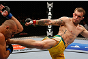 GOLD COAST, AUSTRALIA - DECEMBER 15:  (R-L) Benny Alloway kicks Manuel Rodriguez during their welterweight fight at the UFC on FX event on December 15, 2012  at Gold Coast Convention and Exhibition Centre in Gold Coast, Australia.  (Photo by Josh Hedges/Zuffa LLC/Zuffa LLC via Getty Images)