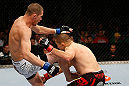 GOLD COAST, AUSTRALIA - DECEMBER 15:  (L-R) Seth Baczynski delivers a knee strike against Mike Pierce during their welterweight fight at the UFC on FX event on December 15, 2012  at Gold Coast Convention and Exhibition Centre in Gold Coast, Australia.  (Photo by Josh Hedges/Zuffa LLC/Zuffa LLC via Getty Images)