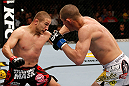 GOLD COAST, AUSTRALIA - DECEMBER 15:  (L-R) Mike Pierce and Seth Baczynski trade punches during their welterweight fight at the UFC on FX event on December 15, 2012  at Gold Coast Convention and Exhibition Centre in Gold Coast, Australia.  (Photo by Josh Hedges/Zuffa LLC/Zuffa LLC via Getty Images)