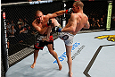 GOLD COAST, AUSTRALIA - DECEMBER 15:  (L-R) Mike Pierce and Seth Baczynski trade strikes during their welterweight fight at the UFC on FX event on December 15, 2012  at Gold Coast Convention and Exhibition Centre in Gold Coast, Australia.  (Photo by Josh Hedges/Zuffa LLC/Zuffa LLC via Getty Images)