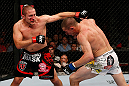 GOLD COAST, AUSTRALIA - DECEMBER 15:  (L-R) Mike Pierce punches Seth Baczynski during their welterweight fight at the UFC on FX event on December 15, 2012  at Gold Coast Convention and Exhibition Centre in Gold Coast, Australia.  (Photo by Josh Hedges/Zuffa LLC/Zuffa LLC via Getty Images)