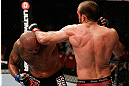 GOLD COAST, AUSTRALIA - DECEMBER 15:  (R-L) Igor Pokrajac and Joey Beltran trade punches during their light heavyweight fight at the UFC on FX event on December 15, 2012  at Gold Coast Convention and Exhibition Centre in Gold Coast, Australia.  (Photo by Josh Hedges/Zuffa LLC/Zuffa LLC via Getty Images)