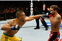 GOLD COAST, AUSTRALIA - DECEMBER 15:  (L-R) Yaotzin Meza punches Chad Mendes during their featherweight fight at the UFC on FX event on December 15, 2012  at Gold Coast Convention and Exhibition Centre in Gold Coast, Australia.  (Photo by Josh Hedges/Zuffa LLC/Zuffa LLC via Getty Images)