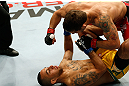 GOLD COAST, AUSTRALIA - DECEMBER 15:  (R-L) Chad Mendes knocks out Yaotzin Meza with punches during their featherweight fight at the UFC on FX event on December 15, 2012  at Gold Coast Convention and Exhibition Centre in Gold Coast, Australia.  (Photo by Josh Hedges/Zuffa LLC/Zuffa LLC via Getty Images)