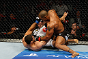 GOLD COAST, AUSTRALIA - DECEMBER 15:  (R-L) Hector Lombard punches Rousimar Palhares during their middleweight fight at the UFC on FX event on December 15, 2012  at Gold Coast Convention and Exhibition Centre in Gold Coast, Australia.  (Photo by Josh Hedges/Zuffa LLC/Zuffa LLC via Getty Images)