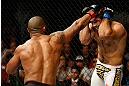 GOLD COAST, AUSTRALIA - DECEMBER 15:  (L-R) Hector Lombard punches Rousimar Palhares during their middleweight fight at the UFC on FX event on December 15, 2012  at Gold Coast Convention and Exhibition Centre in Gold Coast, Australia.  (Photo by Josh Hedges/Zuffa LLC/Zuffa LLC via Getty Images)