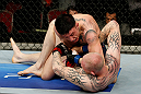 GOLD COAST, AUSTRALIA - DECEMBER 15:  (L-R) Norman Parke delivers an elbow strike against Colin Fletcher during their lightweight fight at the UFC on FX event on December 15, 2012  at Gold Coast Convention and Exhibition Centre in Gold Coast, Australia.  (Photo by Josh Hedges/Zuffa LLC/Zuffa LLC via Getty Images)