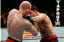 GOLD COAST, AUSTRALIA - DECEMBER 15:  (R-L) Norman Parke punches Colin Fletcher during their lightweight fight at the UFC on FX event on December 15, 2012  at Gold Coast Convention and Exhibition Centre in Gold Coast, Australia.  (Photo by Josh Hedges/Zuffa LLC/Zuffa LLC via Getty Images)