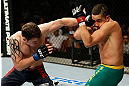 GOLD COAST, AUSTRALIA - DECEMBER 15:  (L-R) Bradley Scott punches Robert Whittaker during their welterweight fight at the UFC on FX event on December 15, 2012  at Gold Coast Convention and Exhibition Centre in Gold Coast, Australia.  (Photo by Josh Hedges/Zuffa LLC/Zuffa LLC via Getty Images)