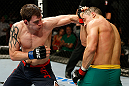 GOLD COAST, AUSTRALIA - DECEMBER 15:  (L-R) Bradley Scott punches Robert Whittaker during their welterweight fight at the UFC on FX event on December 15, 2012  at Gold Coast Convention and Exhibition Centre in Gold Coast, Australia.  (Photo by Josh Hedges/Zuffa LLC/Zuffa LLC via Getty Images)
