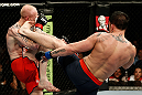 GOLD COAST, AUSTRALIA - DECEMBER 15:  (R-L) Norman Parke kicks Colin Fletcher during their lightweight fight at the UFC on FX event on December 15, 2012  at Gold Coast Convention and Exhibition Centre in Gold Coast, Australia.  (Photo by Josh Hedges/Zuffa LLC/Zuffa LLC via Getty Images)