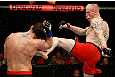 GOLD COAST, AUSTRALIA - DECEMBER 15:  (R-L) Colin Fletcher kicks Norman Parke during their lightweight fight at the UFC on FX event on December 15, 2012  at Gold Coast Convention and Exhibition Centre in Gold Coast, Australia.  (Photo by Josh Hedges/Zuffa LLC/Zuffa LLC via Getty Images)